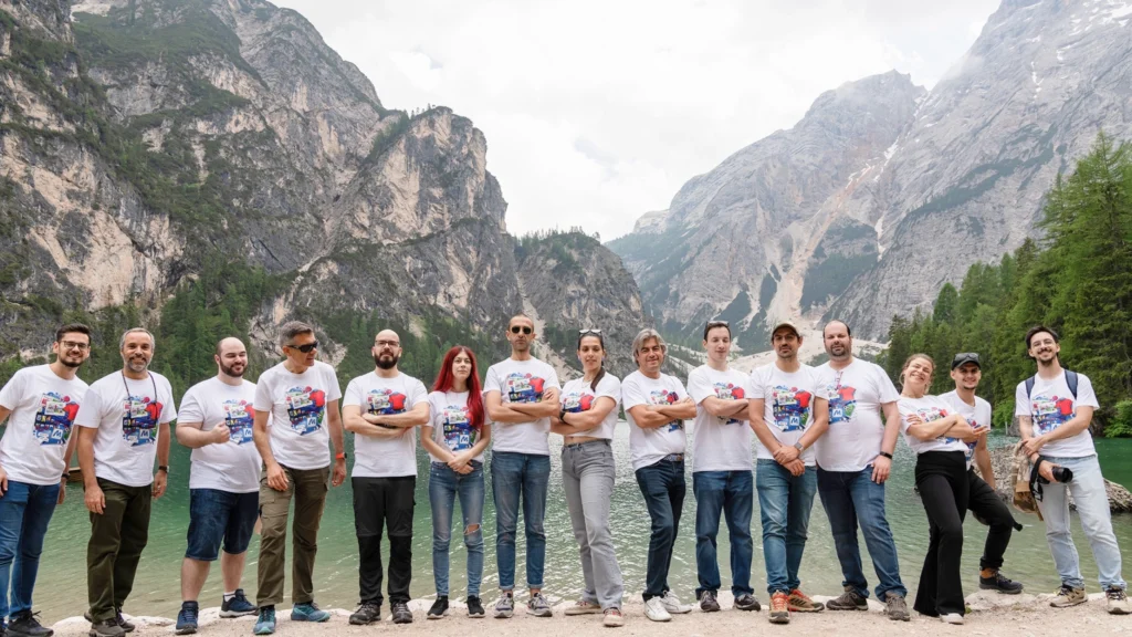 Magycal team in front of a lake in the alps